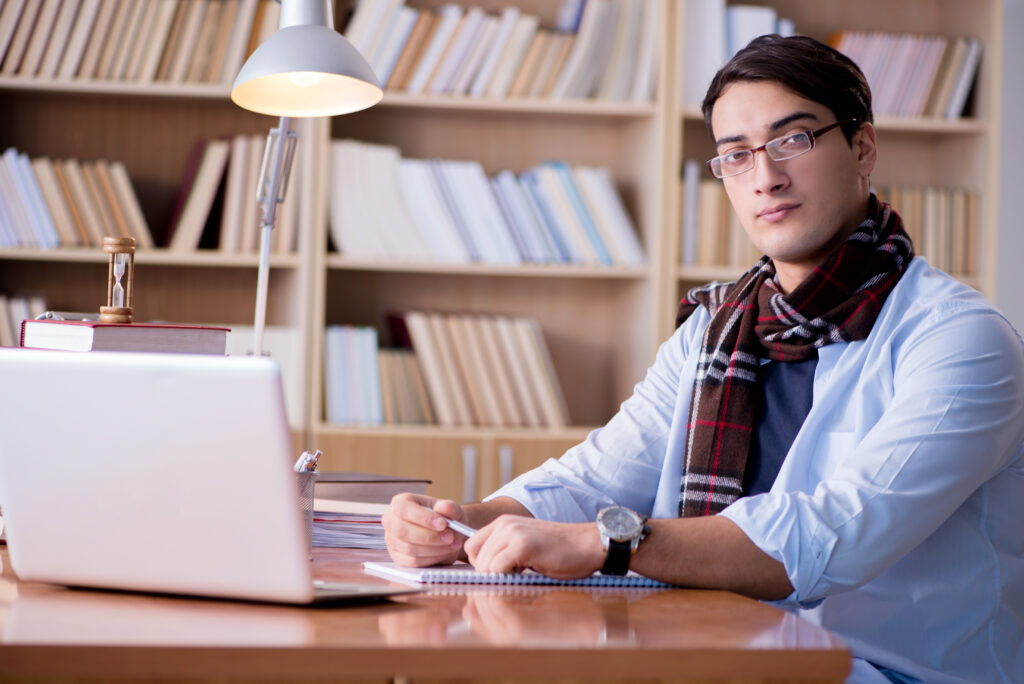 How to Become a Freelance Writer Young writer working in the library